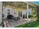 Relaxing back patio with overhead pergola, outdoor seating, and a grill, ideal for summer evenings at 14162 Nicholas Dr, Carmel, IN 46074