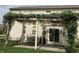 Outdoor space with wisteria covered pergola, chairs and table, perfect for entertaining or relaxing at 14162 Nicholas Dr, Carmel, IN 46074