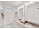 Bright bathroom with granite double vanity and framed mirrors and shower at 14162 Nicholas Dr, Carmel, IN 46074
