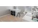 Sunlit bedroom features white furniture, desk, and storage unit at 14162 Nicholas Dr, Carmel, IN 46074