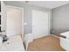 Neutral toned bedroom featuring a large closet and desk at 14162 Nicholas Dr, Carmel, IN 46074