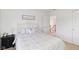 Cozy bedroom featuring carpet, a bed, and doorway to another room at 14162 Nicholas Dr, Carmel, IN 46074