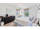 Cozy bedroom featuring a dark wood dresser with many drawers and sunny windows at 14162 Nicholas Dr, Carmel, IN 46074