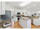 Modern kitchen with stainless appliances, granite countertops, and a center island, perfect for cooking and entertaining at 14162 Nicholas Dr, Carmel, IN 46074