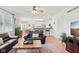 Open-concept living room flowing into a kitchen area, featuring hardwood floors at 14162 Nicholas Dr, Carmel, IN 46074