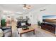 Bright and airy living room with a kitchen and dining area in the background at 14162 Nicholas Dr, Carmel, IN 46074