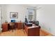 Spacious home office with hardwood floors and ample natural light, perfect for productivity and focus at 14162 Nicholas Dr, Carmel, IN 46074