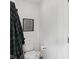 Small water closet featuring a toilet, a painting, and a robe hanging at 14162 Nicholas Dr, Carmel, IN 46074