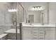 Modern bathroom with a glass-enclosed shower, dual sink vanity, bright lighting, and neutral color palette at 15004 Stonneger St, Westfield, IN 46074