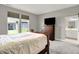 Bedroom with plush carpeting, television, and ensuite bathroom creates a private, comfortable retreat at 15004 Stonneger St, Westfield, IN 46074
