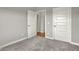 Bedroom featuring a neutral color palette with two doors offering access to other areas of the home at 15004 Stonneger St, Westfield, IN 46074