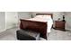 Comfortable bedroom featuring plush carpeting, a wood bed frame, and a nightstand, creating a cozy retreat at 15004 Stonneger St, Westfield, IN 46074