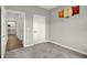 Bright bedroom showing neutral paint and carpeting and offering an entryway to other rooms of the home at 15004 Stonneger St, Westfield, IN 46074