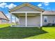 Back view of a home with a covered patio perfect for outdoor lounging and backyard enjoyment at 15004 Stonneger St, Westfield, IN 46074