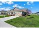 Beautiful single-Gathering home with manicured lawn, attached garage, and classic design elements under a bright sky at 15004 Stonneger St, Westfield, IN 46074
