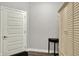 Hallway with hardwood floors, white doors, and trim, providing access to various rooms, with natural light at 15004 Stonneger St, Westfield, IN 46074