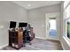 Cozy home office space features hardwood floors, a large desk, and natural light, perfect for working from home at 15004 Stonneger St, Westfield, IN 46074