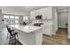 Open kitchen offers white cabinets, stainless appliances, and a spacious island at 15004 Stonneger St, Westfield, IN 46074