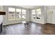 Sunlit living room with large windows and hardwood floors offers a bright and welcoming atmosphere at 15004 Stonneger St, Westfield, IN 46074