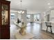 Open-concept living area with hardwood floors, lots of light, kitchen access, and stylish furniture at 15004 Stonneger St, Westfield, IN 46074