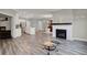Open floor plan with modern kitchen, dining area, and fireplace in the living room at 15004 Stonneger St, Westfield, IN 46074