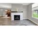 Living room showcasing fireplace, large windows, and open access to the dining area at 15004 Stonneger St, Westfield, IN 46074