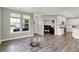 Open floor plan with living room, dining area, and modern kitchen with white cabinets at 15004 Stonneger St, Westfield, IN 46074