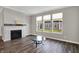 Living room features fireplace, large windows, and modern gray walls at 15004 Stonneger St, Westfield, IN 46074