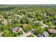 Aerial view of homes in a neighborhood with mature trees and landscaping at 1508 Redwood Dr, Carmel, IN 46032