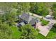 Aerial view of beautiful home with a brick chimney, lush landscaping and a patio seating area at 1508 Redwood Dr, Carmel, IN 46032