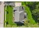 Bird's eye view of a house with pristine green lawn, backyard seating area and a driveway at 1508 Redwood Dr, Carmel, IN 46032
