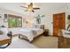 This bedroom features a window with backyard view and wooden trim to match the full size bed frame at 1508 Redwood Dr, Carmel, IN 46032