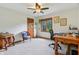 Neutral-toned bedroom with a ceiling fan, wood trim windows, and classic furniture at 1508 Redwood Dr, Carmel, IN 46032