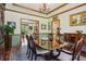 Formal dining room with wood trim, beautiful hutch, and large table with seating at 1508 Redwood Dr, Carmel, IN 46032