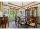 Dining room features a large bay window, a hutch, and seating for six at 1508 Redwood Dr, Carmel, IN 46032