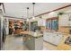 Well-lit kitchen with white cabinets, granite counters, and a breakfast nook at 1508 Redwood Dr, Carmel, IN 46032