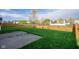 Lush backyard with green grass and a wooden fence; perfect for outdoor activities at 17060 Kingsbridge Blvd, Westfield, IN 46074