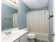 Cozy bathroom features a shower and bath combination with toilet and sleek vanity at 17060 Kingsbridge Blvd, Westfield, IN 46074