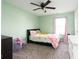 Bright bedroom with a ceiling fan, soft green walls, and natural lighting at 17060 Kingsbridge Blvd, Westfield, IN 46074