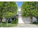 Charming two-story home featuring well-manicured landscaping and an attached two-car garage at 17060 Kingsbridge Blvd, Westfield, IN 46074