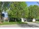 Charming home featuring lush trees and a well-manicured lawn at 17060 Kingsbridge Blvd, Westfield, IN 46074