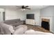 Cozy living room featuring a fireplace, soft lighting, and comfortable seating at 17060 Kingsbridge Blvd, Westfield, IN 46074