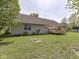 Scenic backyard showcasing a deck, verdant lawn, and tidy landscaping with an exterior home at 1858 Jenny Dr, Martinsville, IN 46151