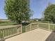 A backyard deck overlooks the spacious lawn and beautiful trees, perfect for relaxation and entertaining at 1858 Jenny Dr, Martinsville, IN 46151