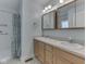 Well-lit bathroom featuring a double vanity and a shower with a curtain at 1858 Jenny Dr, Martinsville, IN 46151