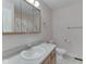 This bathroom features a well-lit mirror and vanity with a clean, functional toilet and classic decor at 1858 Jenny Dr, Martinsville, IN 46151