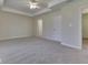 Large bedroom with neutral carpet, ceiling fan, and access to attached bath at 1858 Jenny Dr, Martinsville, IN 46151