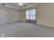 Large bedroom with neutral carpet, a ceiling fan, and closet doors at 1858 Jenny Dr, Martinsville, IN 46151