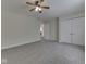 Bedroom with plush carpeting, a ceiling fan, and closet space at 1858 Jenny Dr, Martinsville, IN 46151