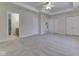 Spacious bedroom with neutral carpet, a ceiling fan, and a bathroom attached at 1858 Jenny Dr, Martinsville, IN 46151